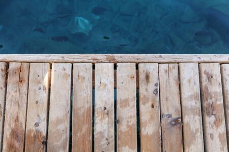 Wooden background and blue sea.の写真素材