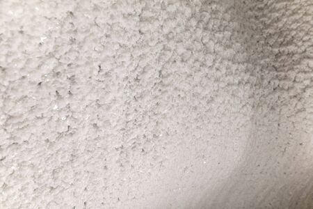 White walls of ice and snow in a cave.