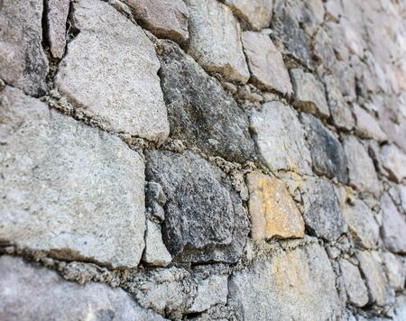 Wall of stone blocks as an abstract background.