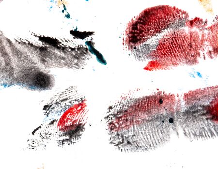 Imprint of a children's hand made of paints on white paper.