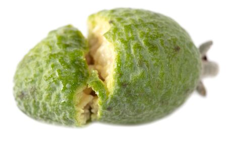 The cut feijoa is isolated on a white background.の写真素材