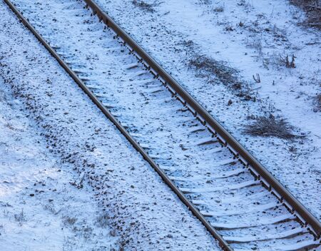 Railway in the snow in winter at dawn.の写真素材