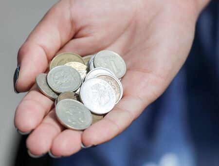 Coins of Russian rubles in the hand.