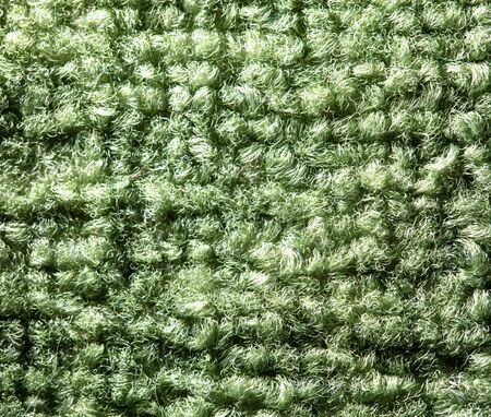 Fabric on a green carpet as an abstract background .の写真素材