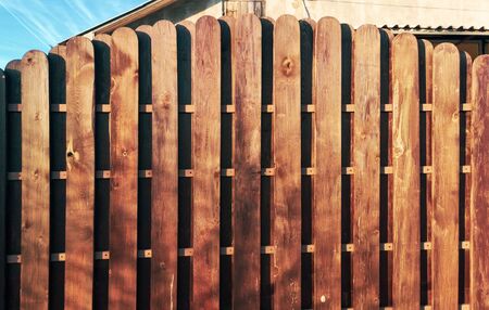 Wooden boards on the fence as a background.