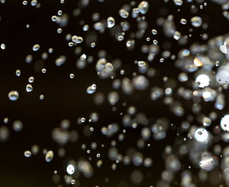 Water splashing from a fountain on summer nature.の写真素材
