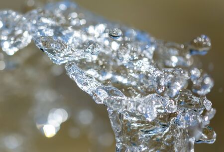 Water splashing from a fountain on summer nature.の写真素材