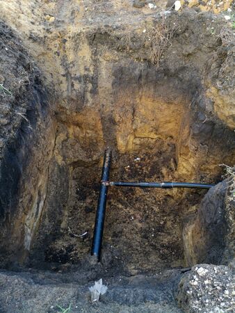 Pit in the ground for the pipe.