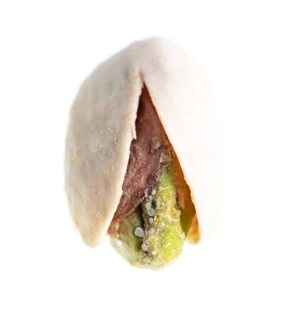 Ripe pistachio nut isolated on a white background.の写真素材