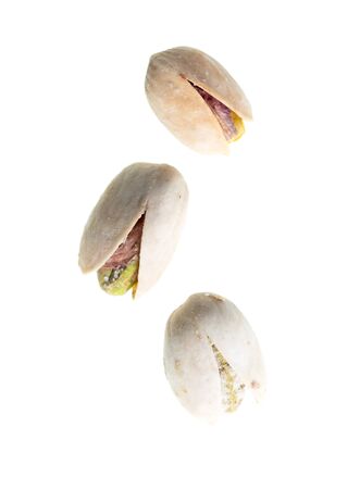Ripe pistachios nuts isolated on a white background.の写真素材