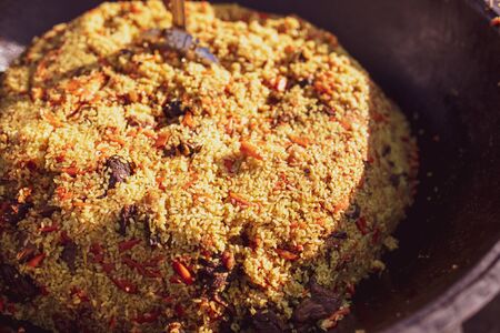 Rice pilaf in a cauldron at the stake.の写真素材