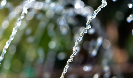 Water splashing from a fountain on summer nature.の写真素材