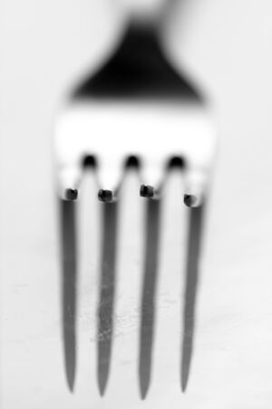 Photo of a fork with shadow.の写真素材