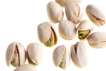 Ripe pistachios nuts isolated on a white background.の写真素材