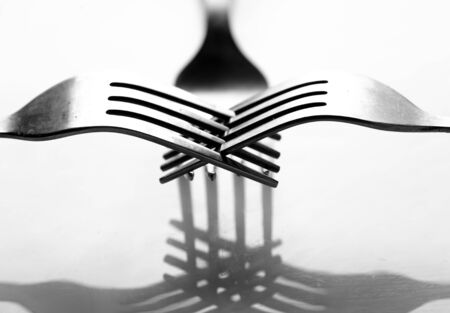 Photo of a fork with shadow.の写真素材