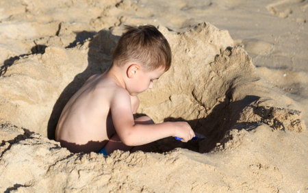 Sanya, Hainan Island, China - January 8, 2020: Boy on the beach in Dadonghai Bay.のeditorial素材