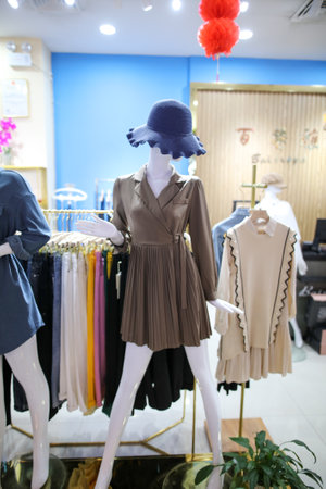Sanya, Hainan Island, China - January 12, 2020: Mannequin with clothes on a shop window.のeditorial素材