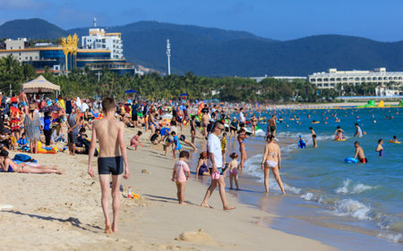 Sanya, Hainan Island, China - January 8, 2020: People bathe on the beach in Dadonghai Bay.のeditorial素材