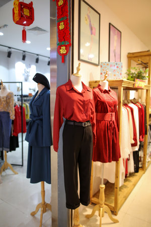 Sanya, Hainan Island, China - January 12, 2020: Mannequin with clothes on a shop window.