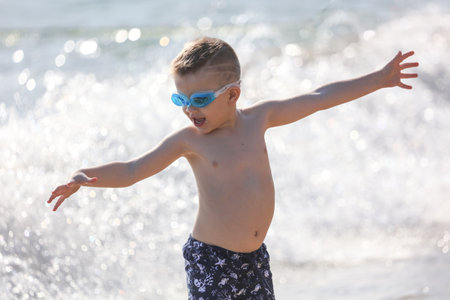 Sanya, Hainan Island, China - January 8, 2020: Boy on the beach in Dadonghai Bay.のeditorial素材