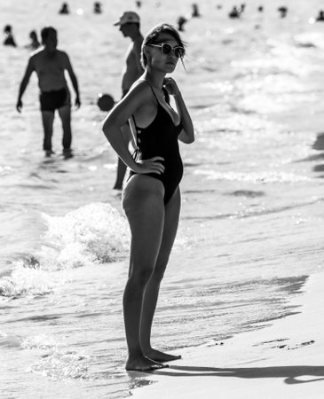 Sanya, Hainan Island, China - January 8, 2020: Girl on the beach in Dadonghai Bay.のeditorial素材