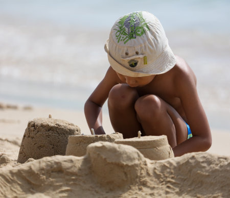Sanya, Hainan Island, China - January 8, 2020: Boy on the beach in Dadonghai Bay.のeditorial素材