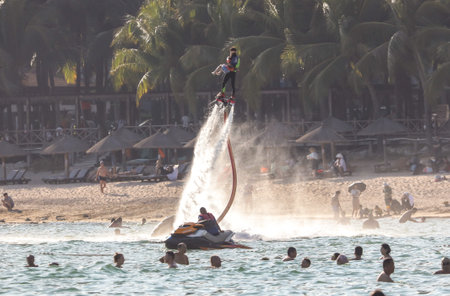 Sanya, Hainan Island, China - January 8, 2020: People bathe on the beach in Dadonghai Bay.のeditorial素材
