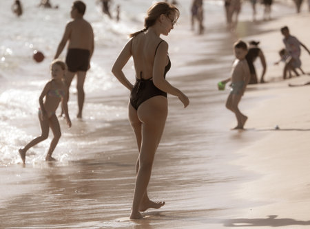 Sanya, Hainan Island, China - January 8, 2020: Girl on the beach in Dadonghai Bay.のeditorial素材