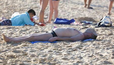 Sanya, Hainan Island, China - January 8, 2020: People bathe on the beach in Dadonghai Bay.のeditorial素材