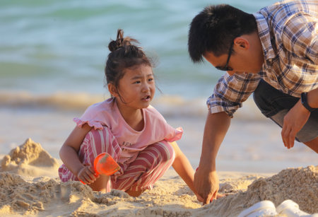 Sanya, Hainan Island, China - January 8, 2020: Girl on the beach in Dadonghai Bay.のeditorial素材