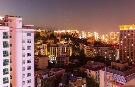 Sanya, Hainan Island, China - January 10, 2020: Beautiful houses at sunset on the city streets.のeditorial素材