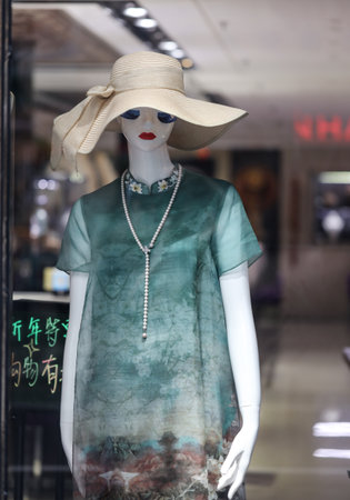 Sanya, Hainan Island, China - January 12, 2020: Mannequin with clothes on a shop window.のeditorial素材