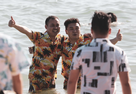Sanya, Hainan Island, China - January 8, 2020: People bathe on the beach in Dadonghai Bay.のeditorial素材