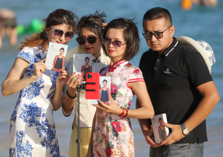 Sanya, Hainan Island, China - January 8, 2020: People bathe on the beach in Dadonghai Bay.のeditorial素材