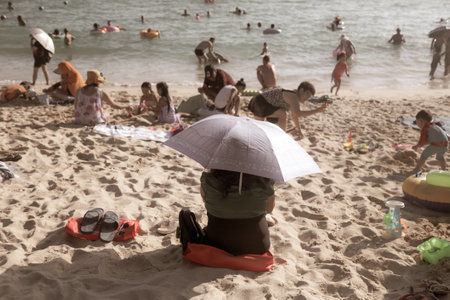 Sanya, Hainan Island, China - January 8, 2020: People bathe on the beach in Dadonghai Bay.のeditorial素材