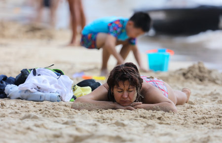 Sanya, Hainan Island, China - January 8, 2020: People bathe on the beach in Dadonghai Bay.のeditorial素材
