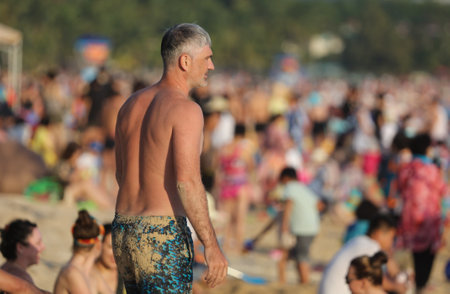 Sanya, Hainan Island, China - January 8, 2020: People bathe on the beach in Dadonghai Bay.のeditorial素材