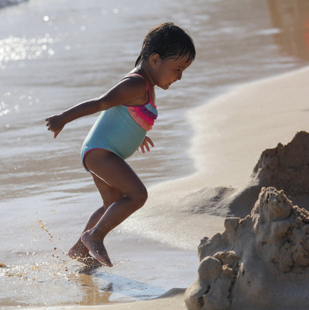 Sanya, Hainan Island, China - January 8, 2020: Girl on the beach in Dadonghai Bay.のeditorial素材