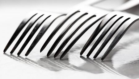 Photo of a fork with shadow.の写真素材