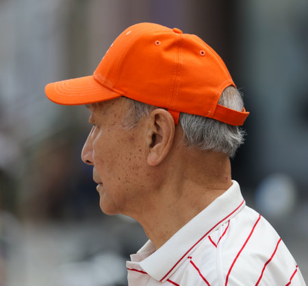 Sanya, Hainan Island, China - January 14, 2020: Chinese grandfather on a city street.のeditorial素材