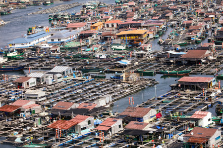 Sanya, Hainan Island, China - January 14, 2020: House of fishermen on the water in the South China Sea.