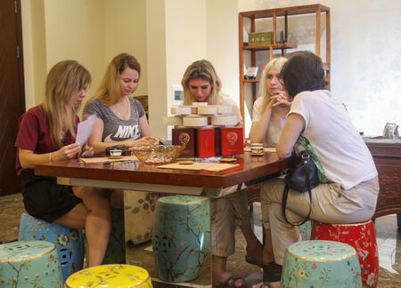 Sanya, Hainan Island, China - January 14, 2020: Russian women are tasting Chinese tea.のeditorial素材