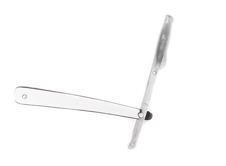 Dangerous razor for cutting hair isolated on a white background. Professional tool