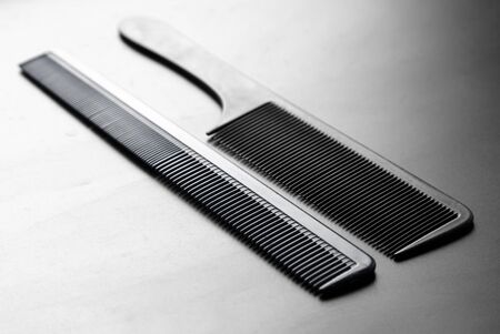 Hair combs on a black background.の写真素材