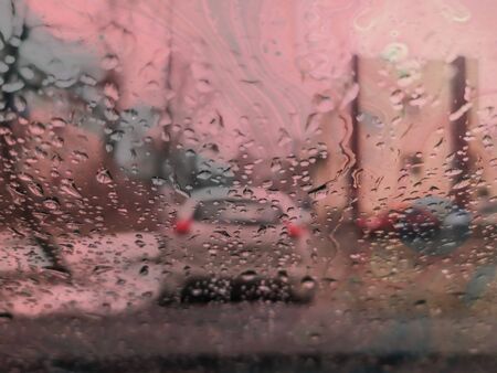 Drops of water on a car glass. Abstract background .