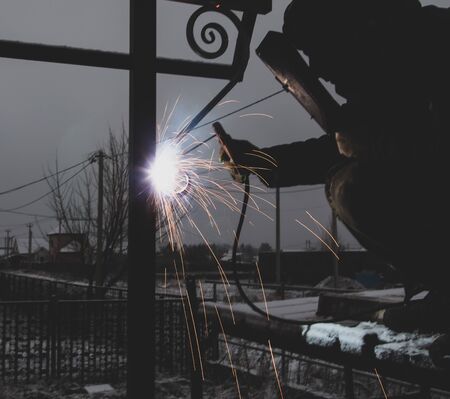 sparks from metal welding at a construction site.の写真素材