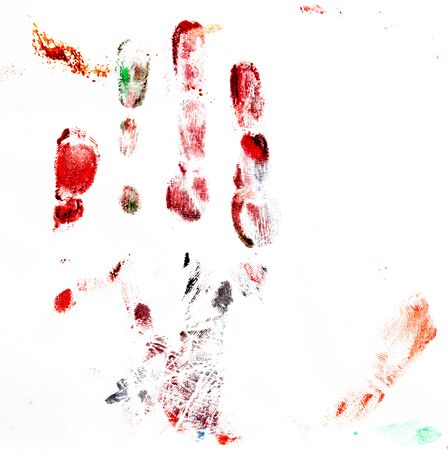 Imprint of a children's hand made of paints on white paper.の写真素材