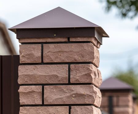 Brick pillar on a fence. Fencingの写真素材