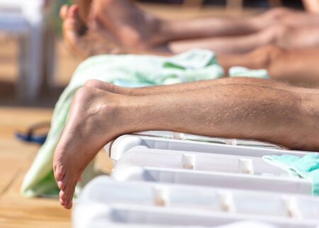 Feet of a girl resting at the resort. Part of the body