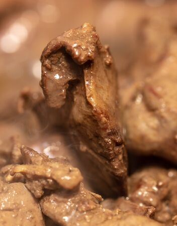Chicken liver is fried in a pan. Macroの写真素材